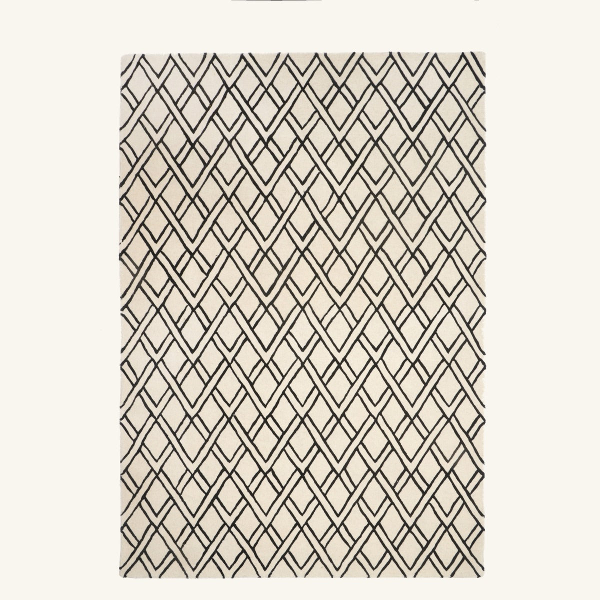 Tapis de salon en laine noir - Isola - fond #F9F6F0 détouré