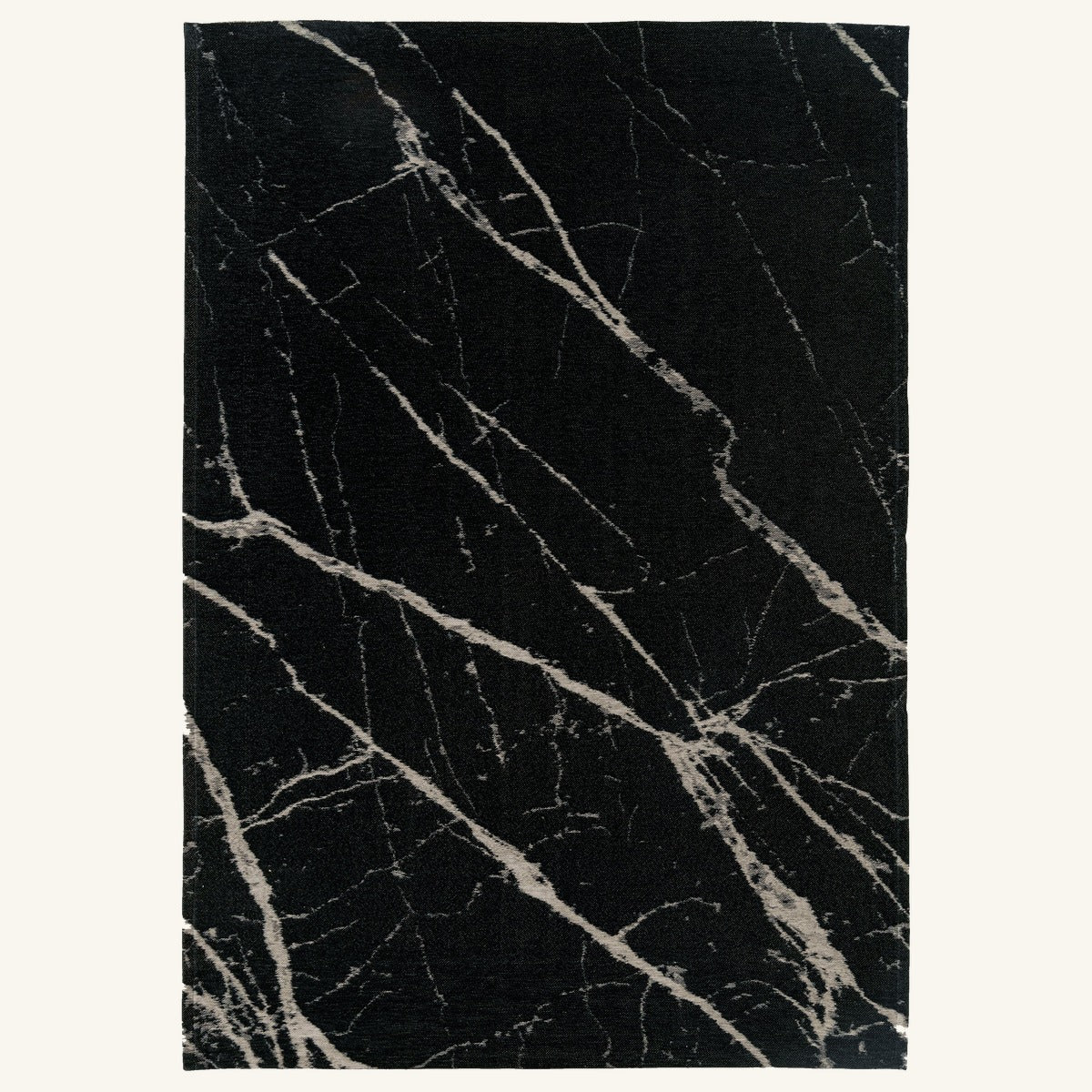 Tapis lavable effet pierre noir - Lecce - fond #F9F6F0 détouré